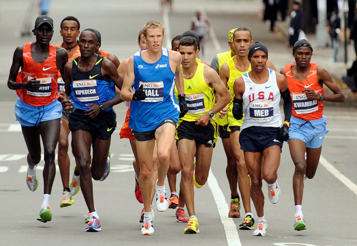 Americans Meb Keflezighi, second from right, and Ryan Hall, center, lead the New York City Marathon, Sunday, Nov. 1, 2009. Keflezighi won the race and Hall was fourth. Kenya's Robert Cheruiyot, left, was second. (AP Photo/Henny Ray Abrams)