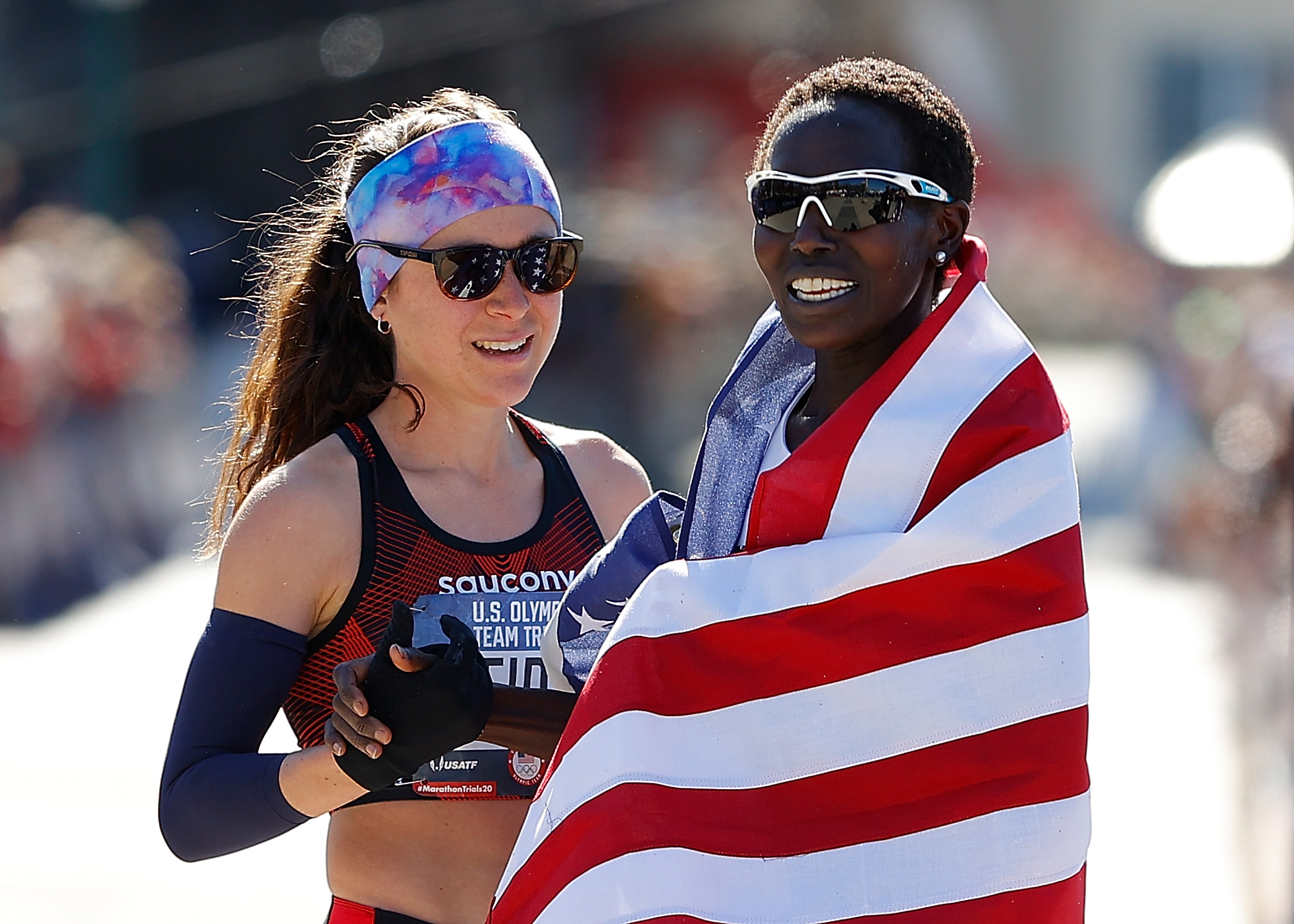 ATLANTA, GEORGIA - FEBRUARY 29: Aliphine Tiliamuk reacts with Molly Seidel after they finished first and second in the Women's U.S. Olympic marathon team trials on February 29, 2020 in Atlanta, Georgia. (Photo by Kevin C. Cox/Getty Images)
