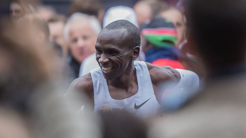 Eliud Kipchoge celebrates his victory after he made history by running sub 2 hr marathon (1:59:40) during INEOS 159 Challenge on Oct 12, 2019 at Vienna, Austria./ Getty Images
