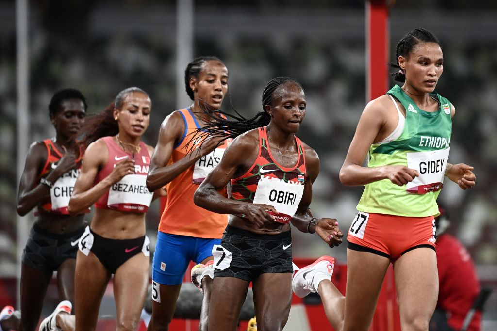 (From L) Netherlands' Sifan Hassan, Kenya's Hellen Obiri and Ethiopia's Letesenbet Gidey compete in the women's 10,000m final during the Tokyo 2020 Olympic Games at the Olympic Stadium in Tokyo on August 7, 2021. (Photo by Jewel SAMAD / AFP) (Photo by JEWEL SAMAD/AFP via Getty Images)